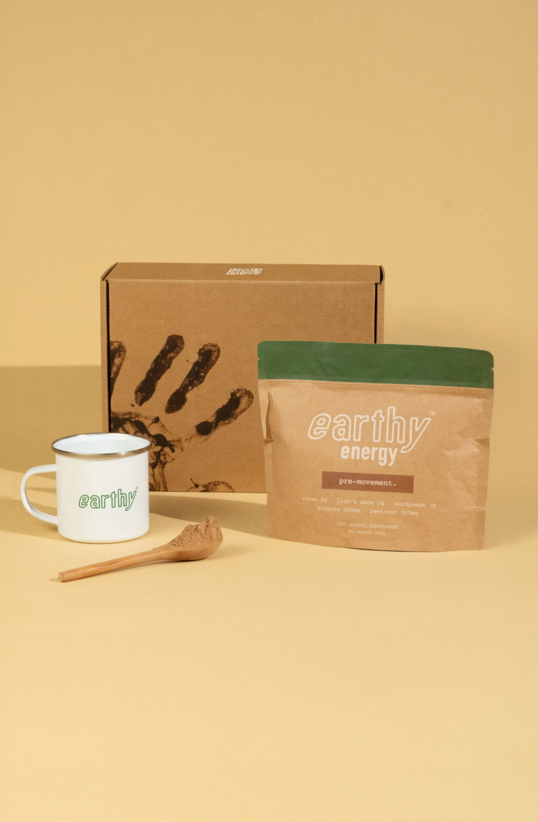 'Brown and green 'Earthy Energy' product bag against a beige background.'